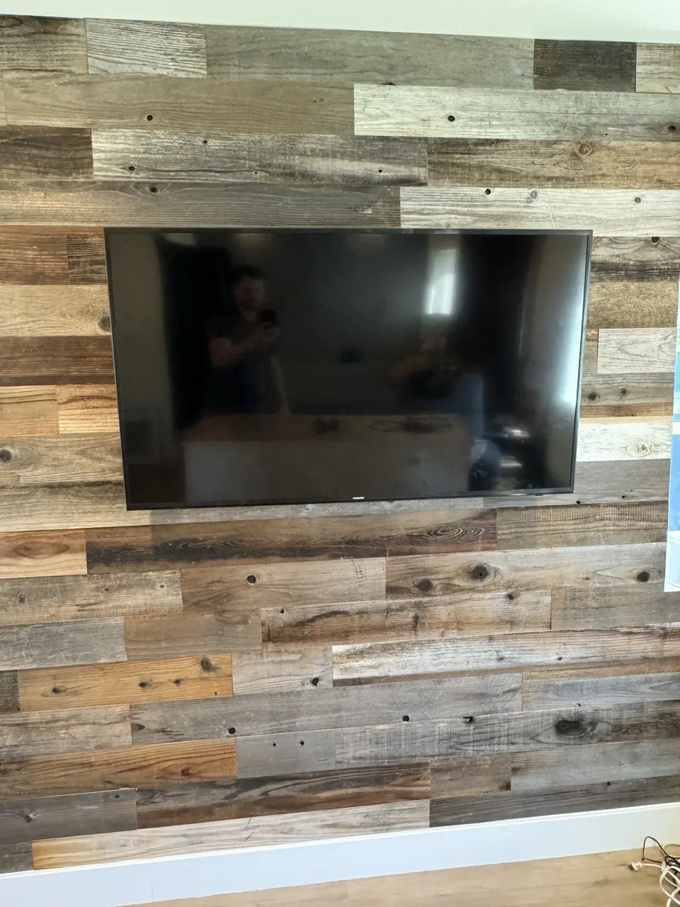 Brick fireplace TV with floating shelves Morrisville NC